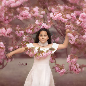 Kiki in a blooming tree